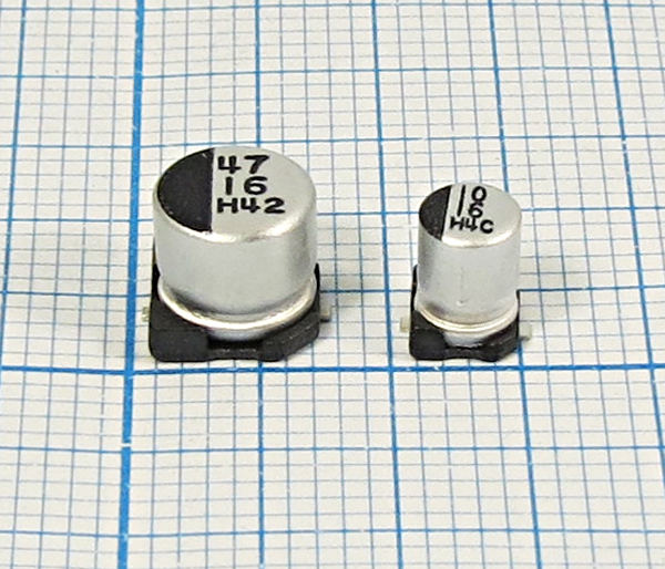 кэ   100\  4\SMD05x05x05C2\20\+85C\Al\2C\SS\KJE